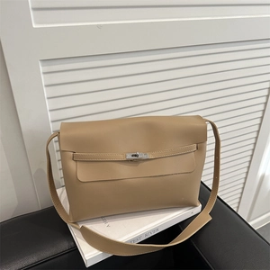 Minimalist beige leather shoulder bag with silver metal buckle on a clean white background