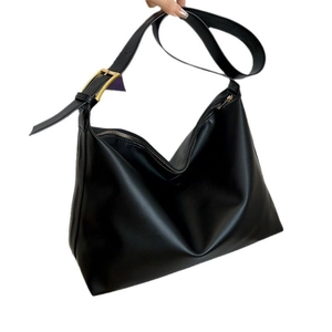 Minimalist black leather hobo bag with gold hardware and adjustable wide strap