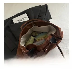 Deep brown suede tote bag interior view showing large capacity and magnetic buckle