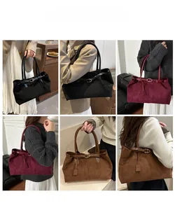 Close-up of vintage large capacity suede tote bags in black, burgundy and dark brown colors