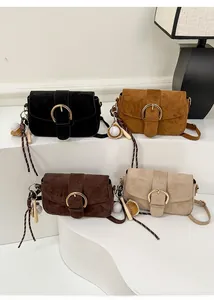 Detailed display of four suede crossbody bags in black, tan, coffee, and beige colors