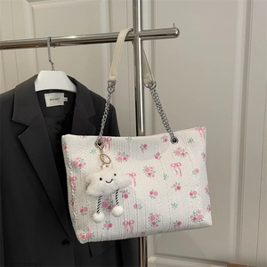 Floral bucket tote bag with chain strap and plush cloud charm for women in 2026