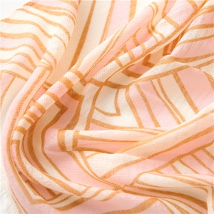 Macro shot of breathable semi-transparent geometric print scarf with pink orange stripes