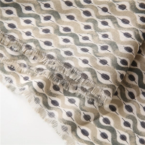 Detailed close-up of woven linen texture scarf with wavy patterns and frayed edges