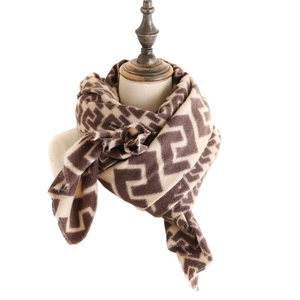 Classic brown and beige geometric pattern cashmere scarf on a vintage mannequin display