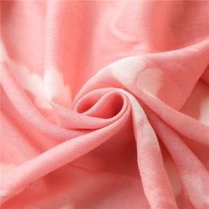 Elegant pink tie-dye cotton linen scarf with soft texture and floral print for women