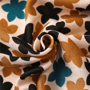 Close-up of floral print cotton scarf showing soft texture and woven fabric details