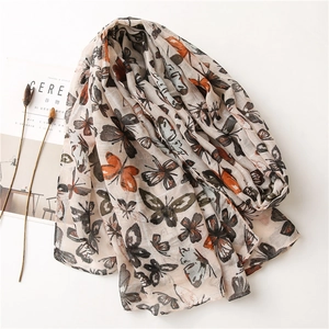 Linen butterfly print scarf for women featuring artistic butterfly motifs on beige fabric