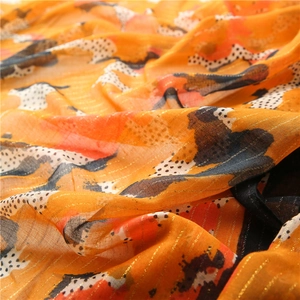 Abstract orange cotton linen scarf with gold silk thread and black polka dot pattern