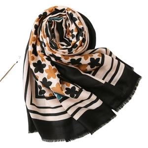 Floral cotton linen scarf with black and yellow flowers and monochrome stripes