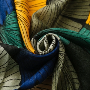 Detailed macro view of the abstract ginkgo print texture on the cotton linen scarf