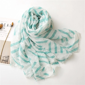 Lightweight cotton linen scarf with mint green geometric stripes and frayed edges