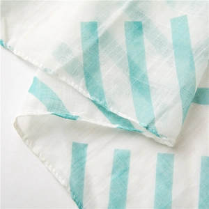 Close-up of lightweight blue striped cotton linen fabric showing breathable texture