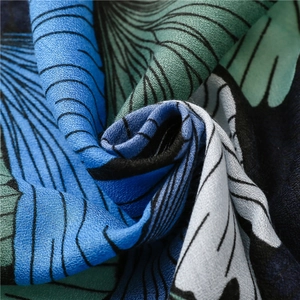 Detailed close-up showing the blue and green ginkgo leaf print on linen-feel fabric