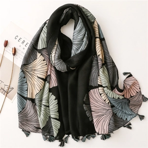 Cotton linen feel scarf with retro ginkgo print and tassels on white background