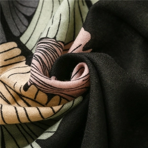 Macro shot of cotton linen scarf showing ginkgo print texture and woven fringe details