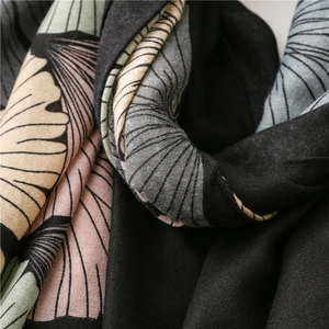 Close-up of vintage ginkgo leaf print on soft linen-feel fabric with fringed edges