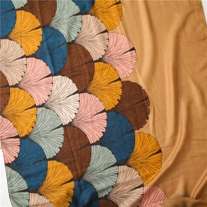Macro detail of retro ginkgo leaf print on soft linen-feel fabric with natural folds