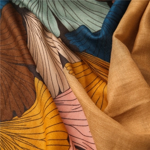 Detail of vintage ginkgo print on cotton linen scarf featuring soft texture folds