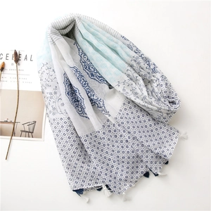 Lightweight cotton linen floral scarf with blue tassels and vintage print on white background