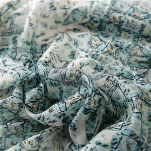 Detail of blue geometric diamond pattern on breathable lightweight chiffon scarf