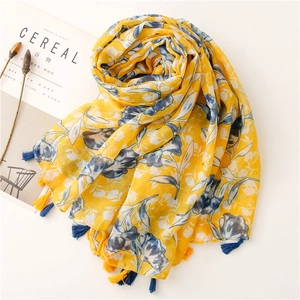 Floral cotton linen scarf in lemon yellow with blue fringes and large flower prints