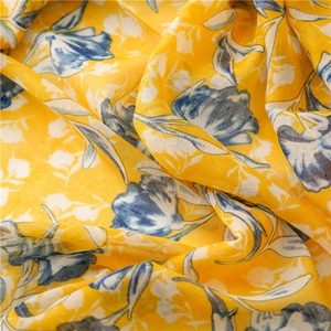 Lightweight lemon yellow cotton linen scarf featuring blue and white floral patterns