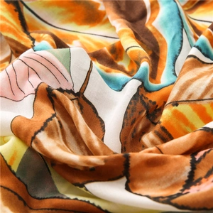 Macro shot of abstract colorful leaf print on soft lightweight linen silk scarf fabric