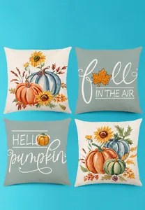 Détail de quatre housses de coussin d'automne avec imprimés citrouille et tournesol en lin