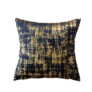 Modern velvet cushion cover in navy blue with elegant gold foil abstract texture