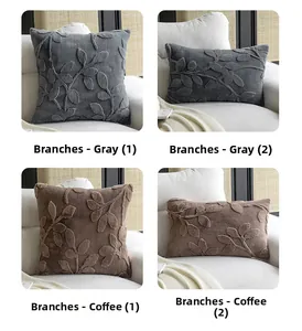 Detailed close-up of plush throw pillows with textured leaf patterns in grey and coffee colors