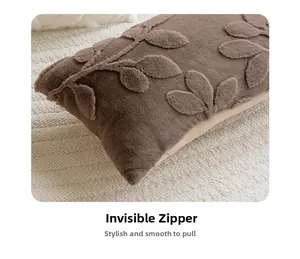 Detail of plush throw pillow case with 3D leaf texture and hidden zipper closure