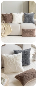 Detail of plush jacquard cushion covers with 3D leaf pattern in neutral tones