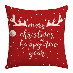 Red Christmas pillow cover with white Merry Christmas text and reindeer antlers