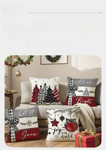 Close-up of four red and white Christmas pillow covers with holiday patterns and greetings