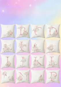 Detail view of floral alphabet pillow covers with soft pink flower patterns and letters