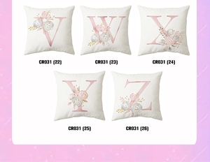Macro view of five pink floral watercolor alphabet pillow covers with V W X Y Z designs