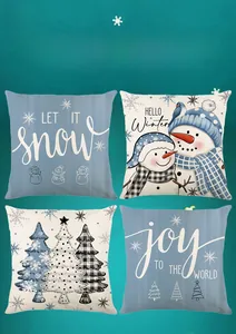 Detail view of four blue Christmas pillow covers with snowman and snowflake prints