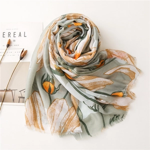Detailed view of the soft sage green cotton linen scarf with floral tulip patterns