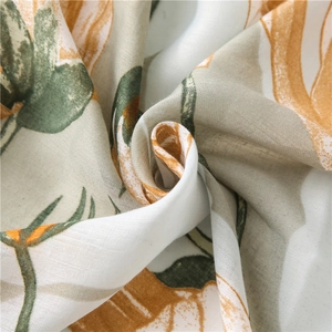 Elegant linen-cotton scarf featuring soft floral tulip print in fresh pastel colors