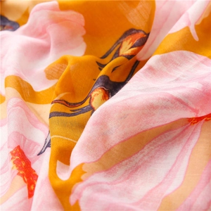 Detail shot of lightweight cotton linen scarf showing soft floral print texture