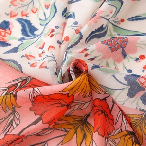 Close-up of cotton linen scarf with colorful floral patterns and soft fabric texture