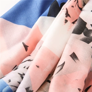 Macro detail of abstract blue and pink geometric print on lightweight cotton linen fabric