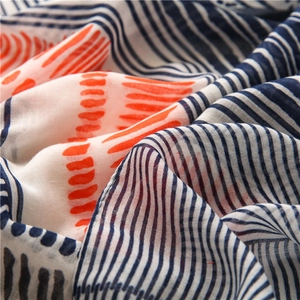Navy and coral striped linen-feel scarf for women with elegant abstract print and fringes