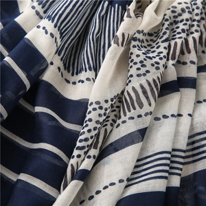 Detailed macro shot of navy blue and beige abstract cotton linen scarf texture