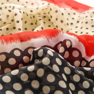 Detailed close-up of lightweight polka dot linen scarf showing breathable fabric texture