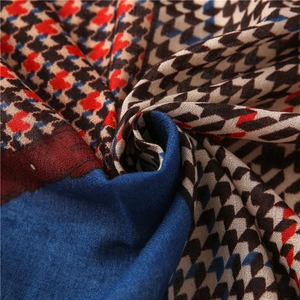 Macro detail of houndstooth patchwork cotton linen scarf with twill weave texture