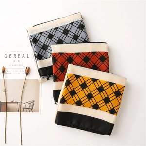 Minimalist plaid scarves in blue, orange, and yellow with checkered cotton linen texture
