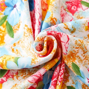 Close-up of vintage oil painting style floral cotton fabric with colorful patterns