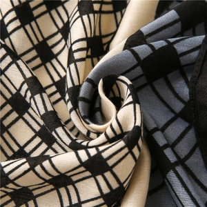 Close-up of geometric color block scarf featuring thick cotton linen twill texture